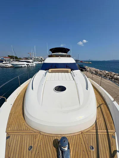  Yacht Photos Pics Luxury 2007 Princess 21M yacht docked at marina, clear sky, wooden deck.