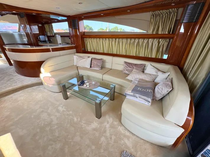  Yacht Photos Pics Luxurious interior of 2007 Princess 21M yacht with elegant seating and glass table.