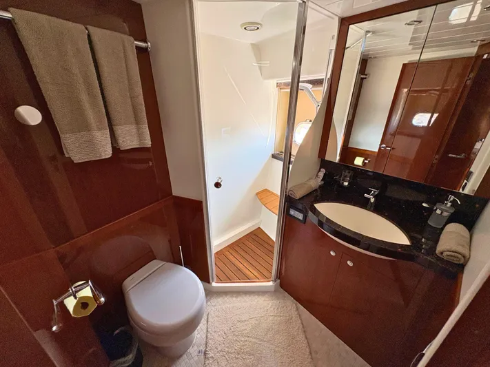  Yacht Photos Pics Luxurious yacht bathroom with shower, sink, and toilet in a 2007 Princess 21M model.