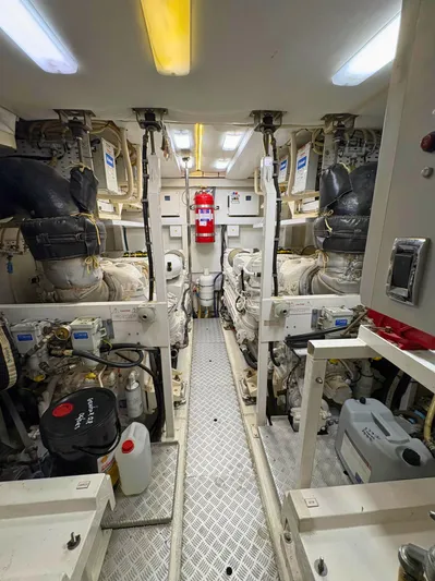  Yacht Photos Pics Engine room of a 2007 Princess 21M yacht, featuring dual engines and safety equipment.