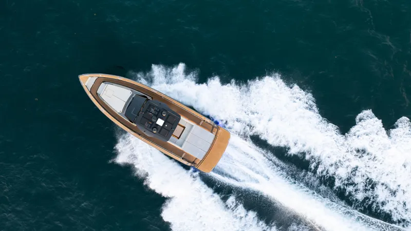Love$ick Yacht Photos Pics 2023 Pardo Yachts P50 cruising on open water, aerial view.