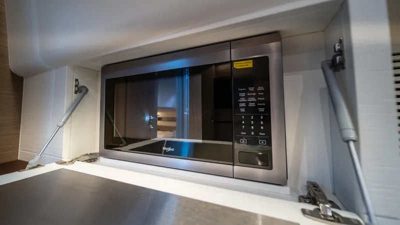 Love$ick Yacht Photos Pics Built-in microwave in 2023 Pardo Yachts P50 galley, featuring modern design and functionality.