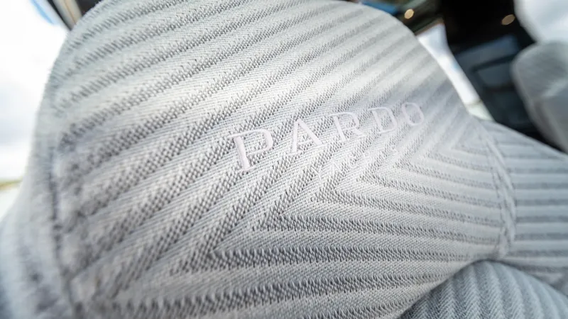 Love$ick Yacht Photos Pics Close-up of 2023 Pardo Yachts P50 seat with embossed logo and textured fabric.