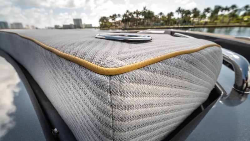 Love$ick Yacht Photos Pics 2023 Pardo Yachts P50 close-up of cushioned deck detail with scenic background.