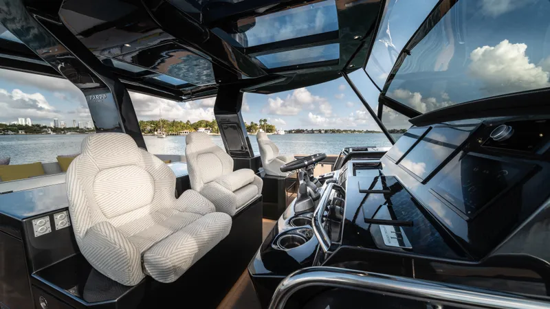 Love$ick Yacht Photos Pics Luxurious interior of 2023 Pardo Yachts P50 with plush seating and modern dashboard.