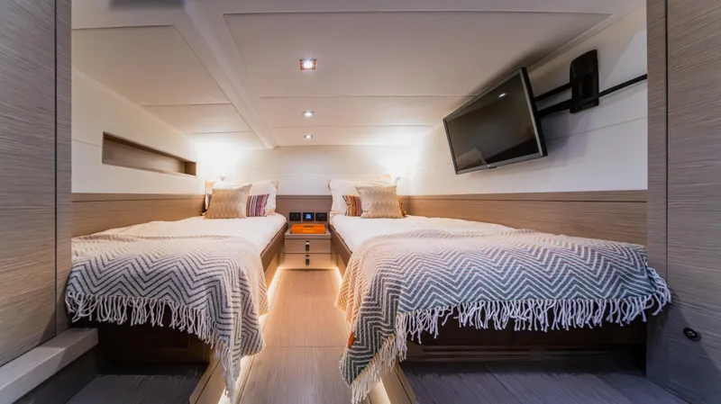 Love$ick Yacht Photos Pics Luxurious 2023 Pardo Yachts P50 cabin with twin beds and modern decor.