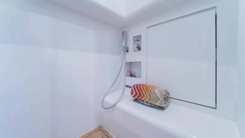 Love$ick Yacht Photos Pics Modern shower area in 2023 Pardo Yachts P50, featuring sleek design and colorful towel.