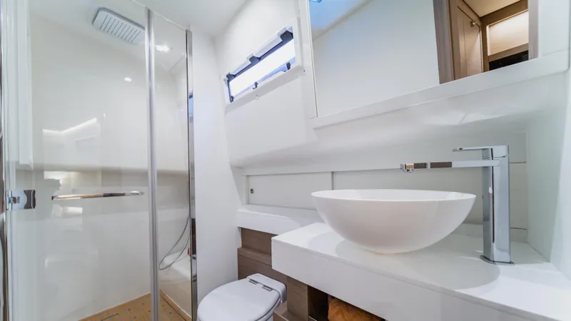 Love$ick Yacht Photos Pics Luxurious bathroom in 2023 Pardo Yachts P50, featuring modern fixtures and elegant design.