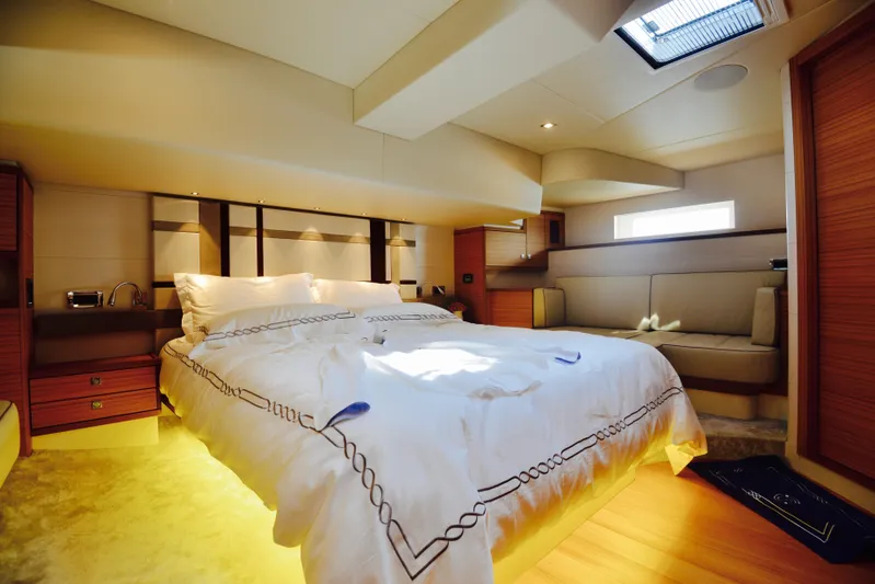  Yacht Photos Pics Luxurious bedroom interior of 2017 Mazarin 72 Cruiser/Racer yacht with elegant bedding and ambient lighting.