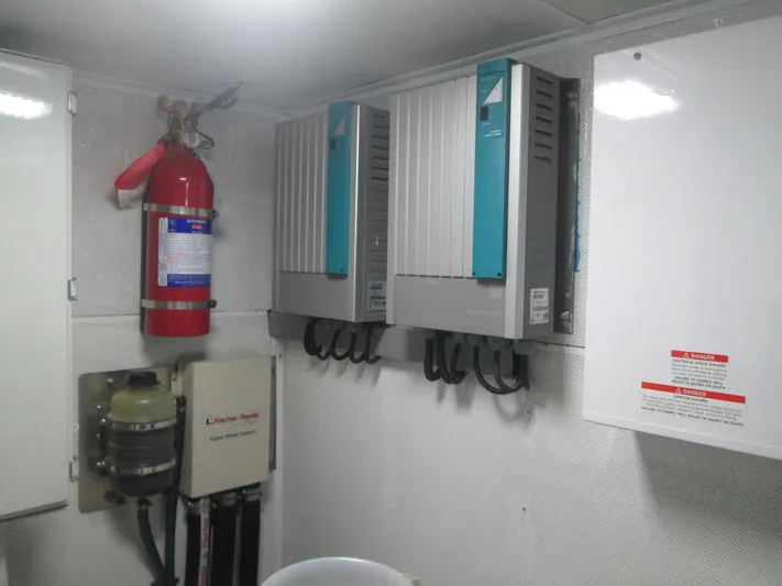  Yacht Photos Pics Electrical control room of 2017 Mazarin 72 Cruiser/Racer with fire extinguisher and equipment.