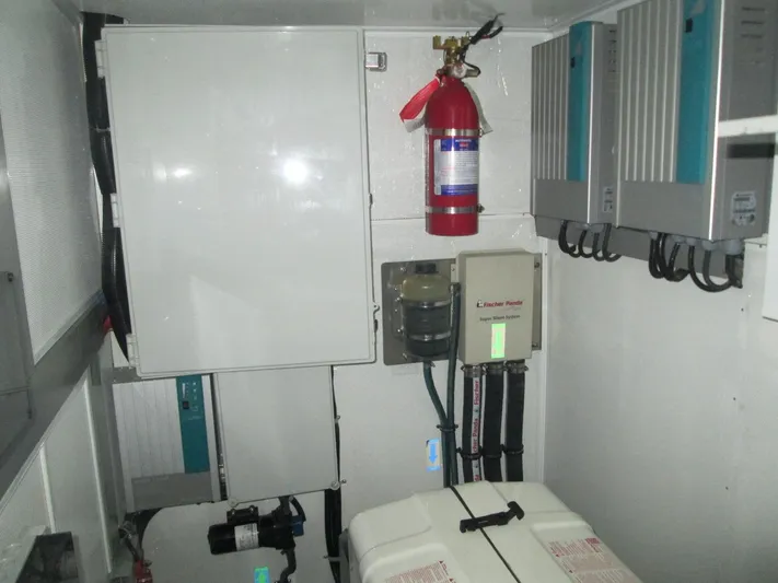  Yacht Photos Pics Electrical control room of 2017 Mazarin 72 Cruiser/Racer with fire extinguisher and equipment.