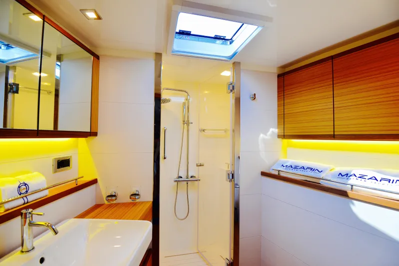  Yacht Photos Pics Luxurious bathroom interior of 2017 Mazarin 72 Cruiser/Racer yacht with modern fixtures and skylight.