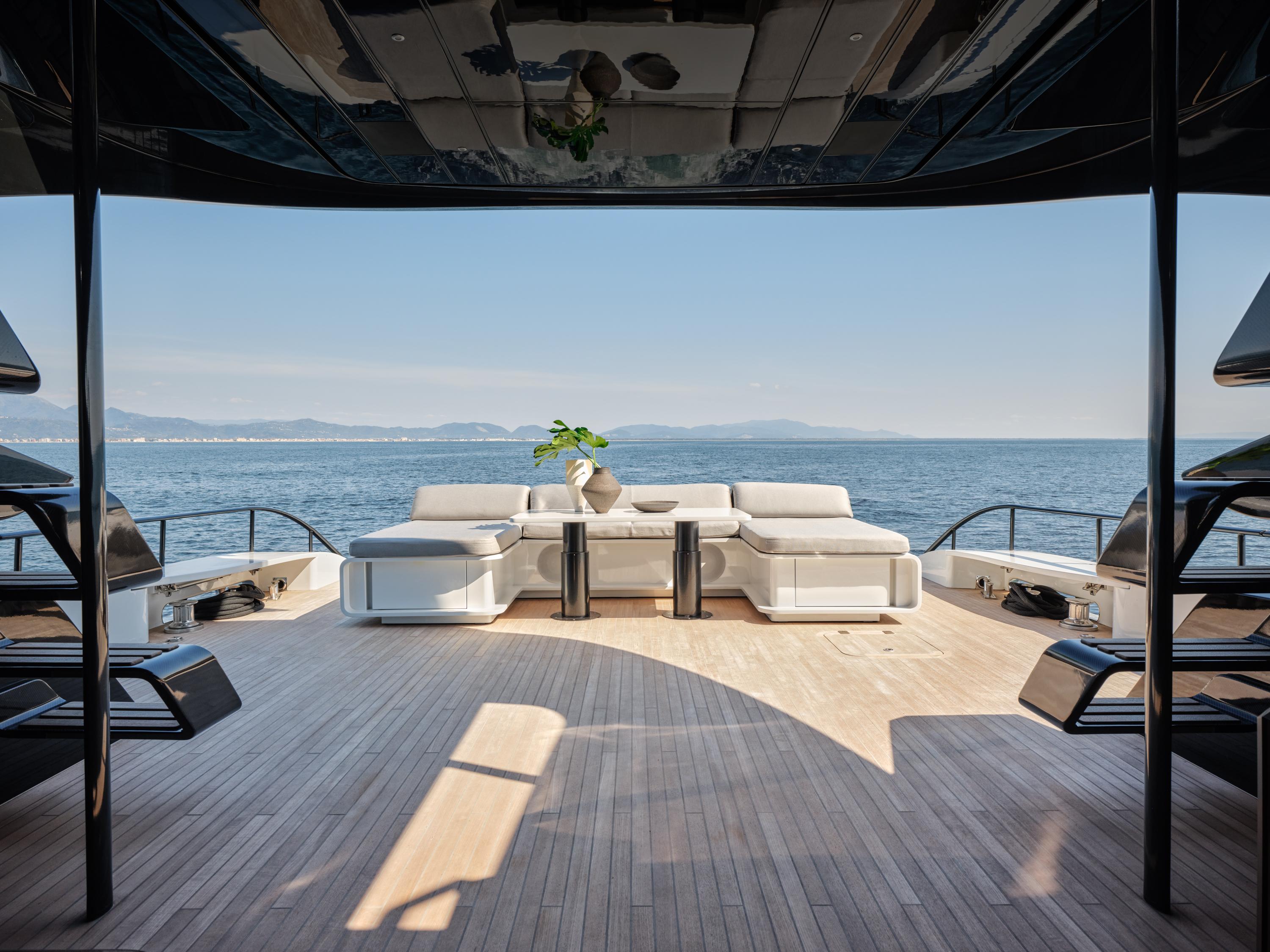 Luxurious AB 110 yacht deck with modern seating, ocean view, and elegant design, 2025 model.