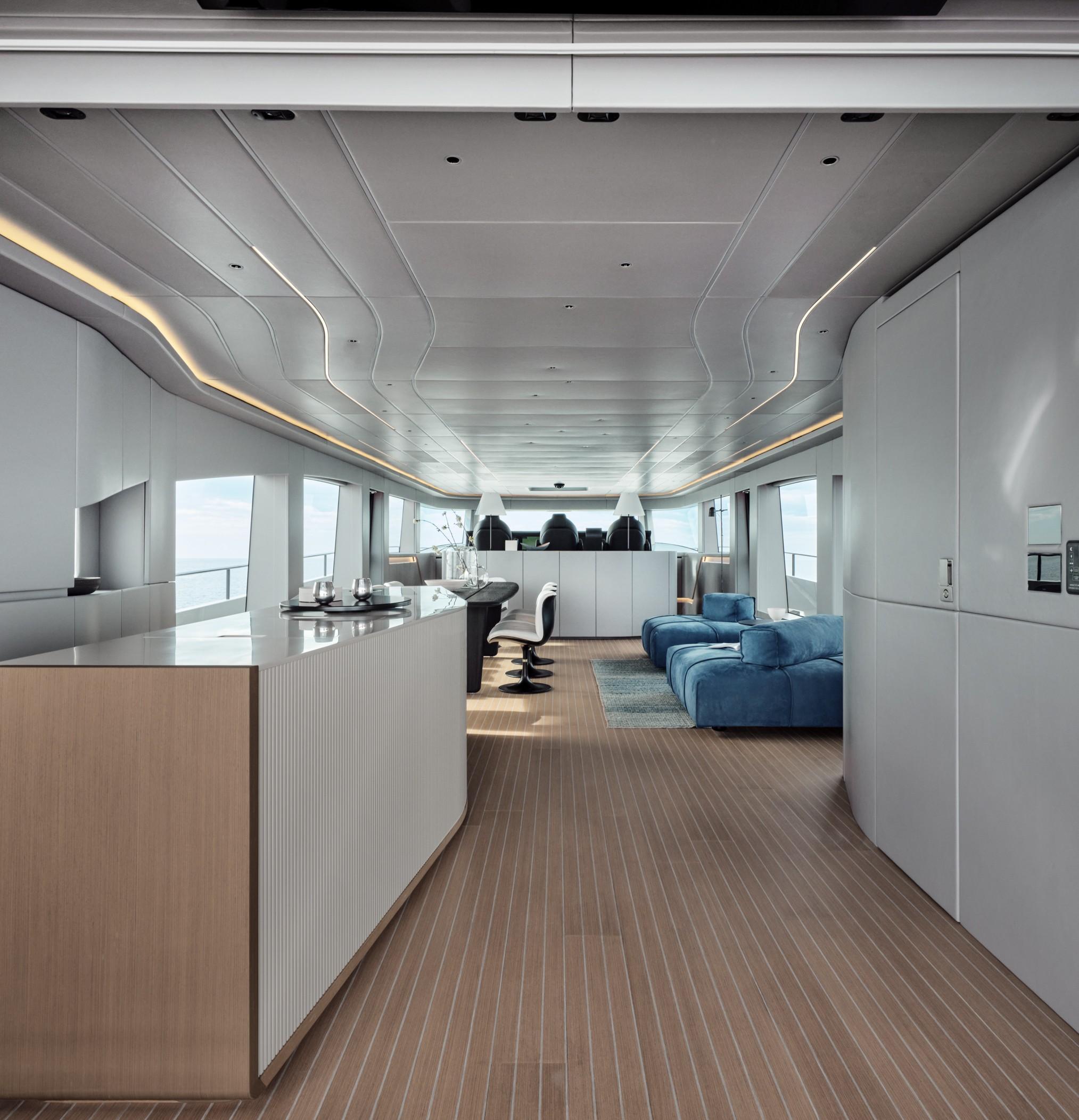 Luxurious yacht interior with modern design, featuring sleek furnishings and panoramic windows. AB 110, 2025 model.