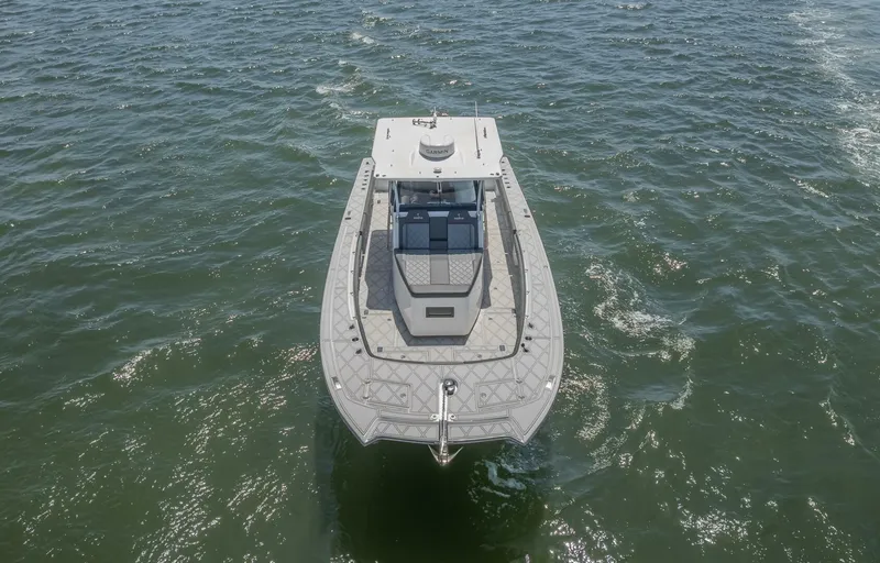  Yacht Photos Pics 2025 Sedna 37 Open boat cruising on open water, aerial view.