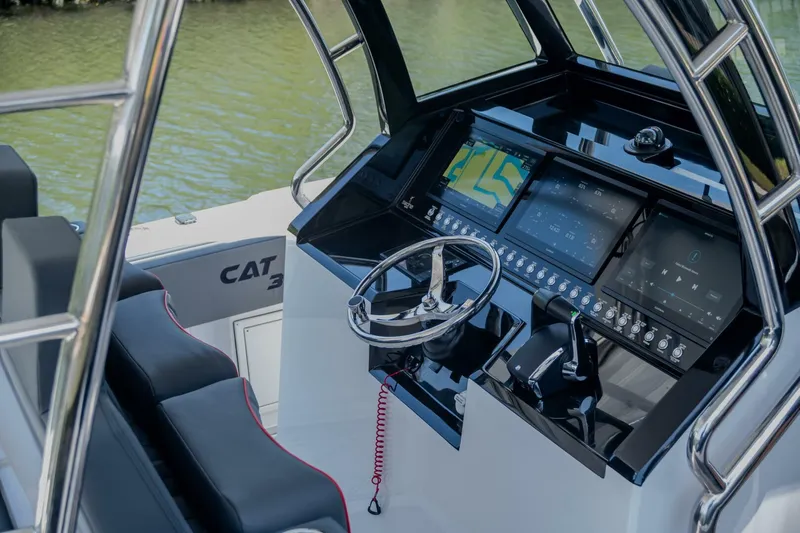  Yacht Photos Pics 2025 Sedna 37 Open boat cockpit with modern navigation controls and steering wheel.