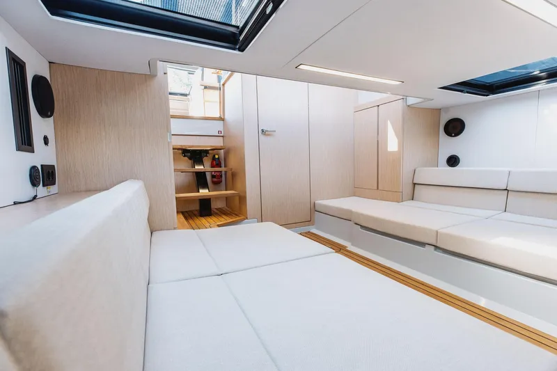  Yacht Photos Pics Luxurious interior of 2026 XO Boats EXPLR 44 with modern seating and natural light.