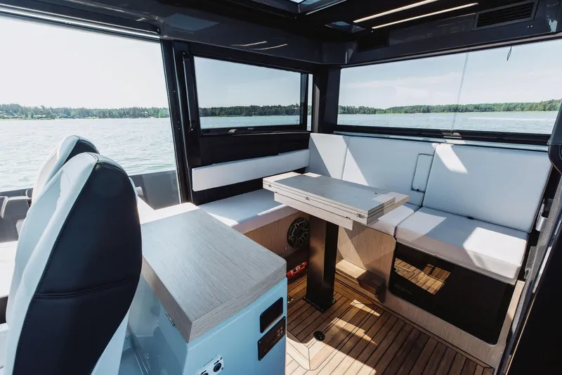  Yacht Photos Pics Interior of 2026 XO Boats EXPLR 44, featuring modern seating and sleek design on the water.