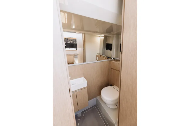  Yacht Photos Pics Modern bathroom interior of 2026 XO Boats EXPLR 44, featuring sleek design and compact amenities.