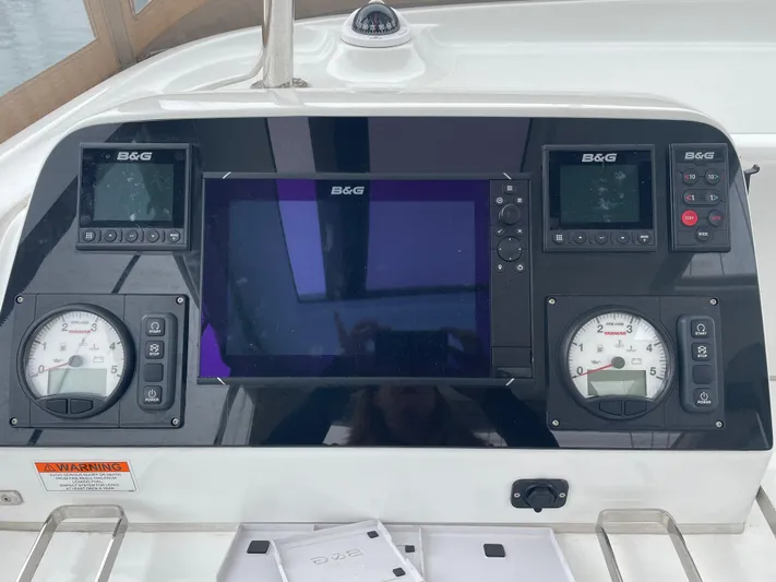 Hullchal Yacht Photos Pics Helm controls of a 2021 Lagoon 42 catamaran with B&G navigation displays.