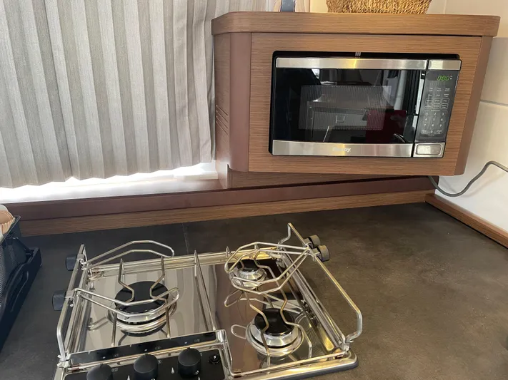Hullchal Yacht Photos Pics Modern kitchen in 2021 Lagoon 42 yacht with stove and microwave.