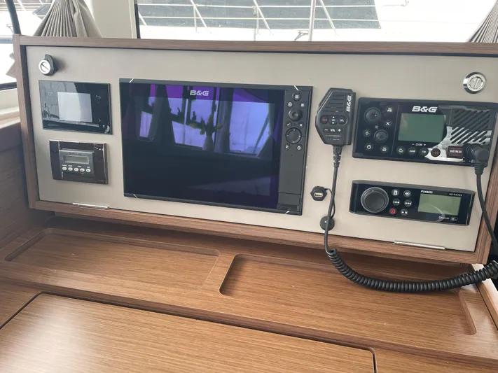 Hullchal Yacht Photos Pics Control panel of a 2021 Lagoon 42 yacht with navigation equipment.