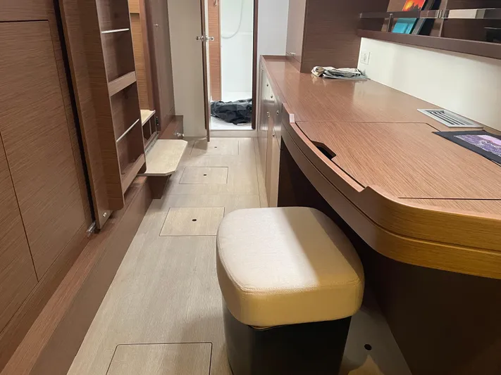 Hullchal Yacht Photos Pics Interior of 2021 Lagoon 42 yacht with wooden desk and seating area.