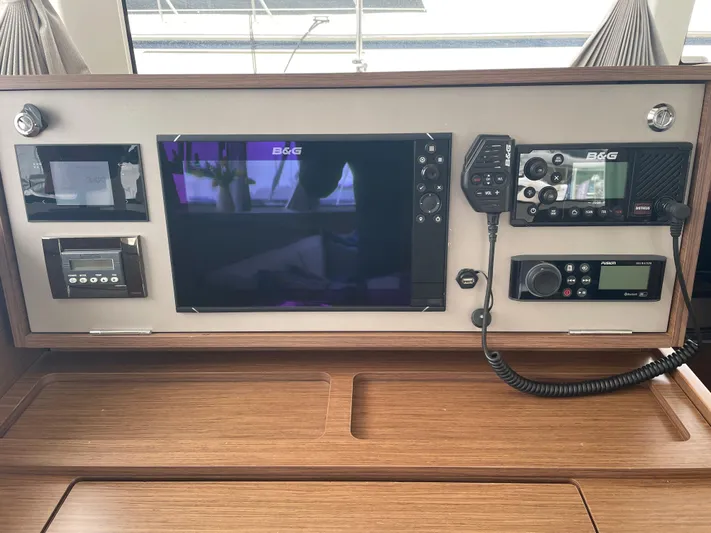 Hullchal Yacht Photos Pics Control panel of a 2021 Lagoon 42 yacht with navigation and communication equipment.