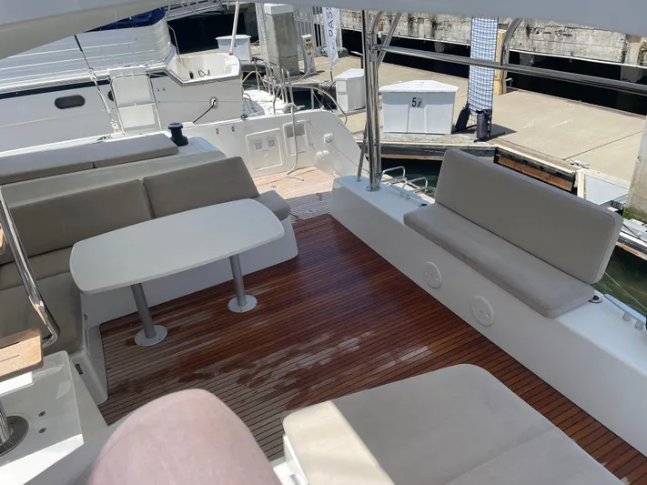 Hullchal Yacht Photos Pics Spacious deck of a 2021 Lagoon 42 catamaran with comfortable seating and table.
