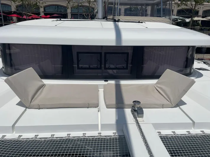 Hullchal Yacht Photos Pics 2021 Lagoon 42 catamaran with sun loungers on deck, featuring modern design and spacious layout.