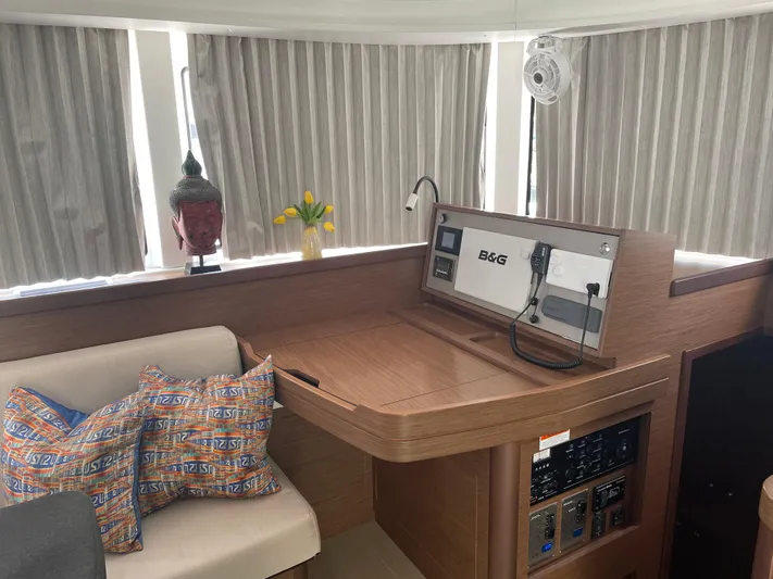 Hullchal Yacht Photos Pics Interior of 2021 Lagoon 42 yacht with navigation station and decorative elements.