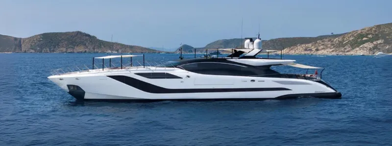 N1 Yacht Photos Pics 2022 Mangusta 165 REV yacht cruising in scenic coastal waters.