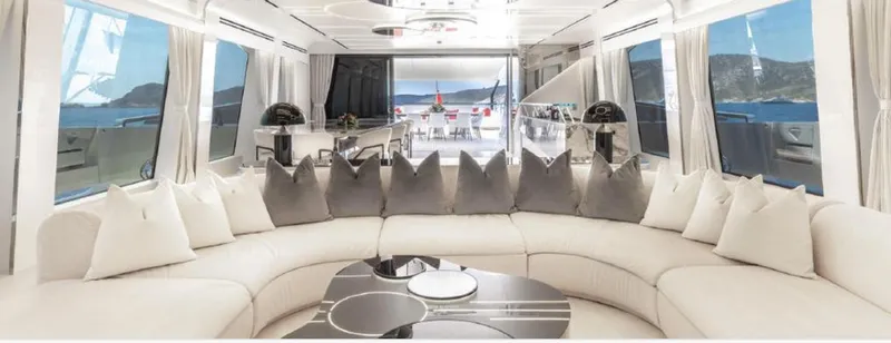 N1 Yacht Photos Pics Luxurious interior of 2022 Mangusta 165 REV yacht with elegant seating and panoramic ocean views.