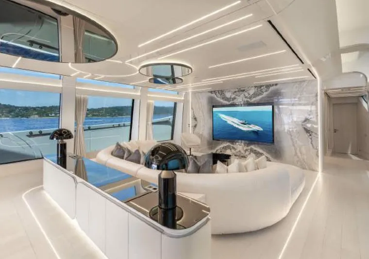 N1 Yacht Photos Pics Luxurious interior of 2022 Mangusta 165 REV yacht with modern design and panoramic windows.