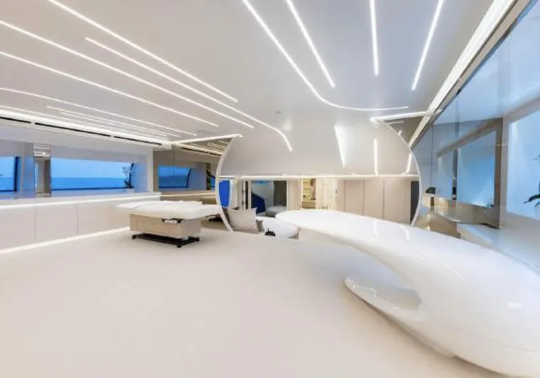 N1 Yacht Photos Pics Luxurious interior of 2022 Mangusta 165 REV yacht with modern design and ambient lighting.