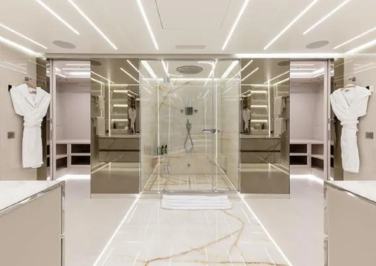 N1 Yacht Photos Pics Luxurious bathroom on 2022 Mangusta 165 REV yacht, featuring modern design and elegant lighting.
