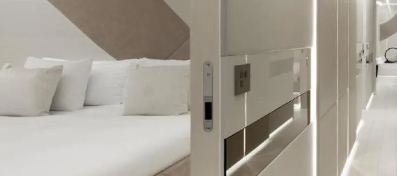 N1 Yacht Photos Pics Luxurious interior of 2022 Mangusta 165 REV yacht, featuring modern design and elegant furnishings.