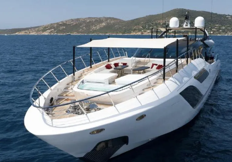 N1 Yacht Photos Pics Luxurious 2022 Mangusta 165 REV yacht cruising on open sea with scenic background.