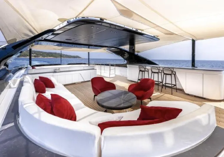 N1 Yacht Photos Pics Luxurious 2022 Mangusta 165 REV yacht deck with elegant seating and ocean view.