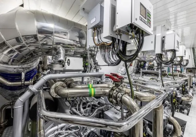 N1 Yacht Photos Pics Engine room of 2022 Mangusta 165 REV yacht with complex machinery and control panels.