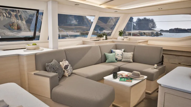  Yacht Photos Pics Luxurious interior of 2025 Fountaine Pajot NEW 44 catamaran with modern seating and scenic views.