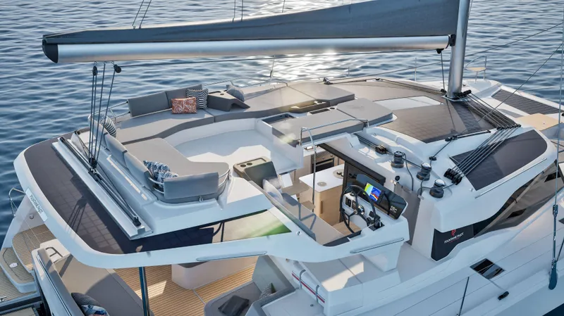  Yacht Photos Pics 2025 Fountaine Pajot NEW 44 catamaran with modern deck and sleek design on calm water.