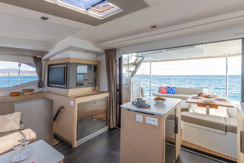  Yacht Photos Pics Luxurious interior of 2026 Fountaine Pajot FP 44 catamaran with ocean view.