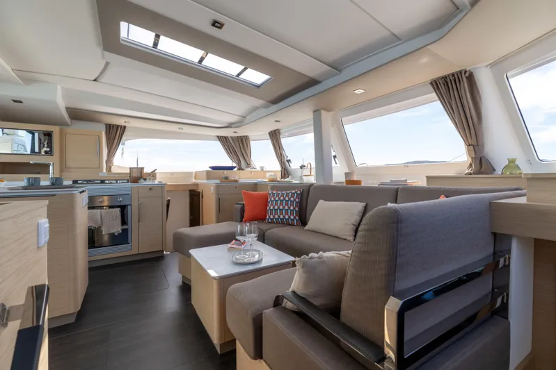  Yacht Photos Pics Luxurious interior of 2026 Fountaine Pajot FP 44 catamaran with modern furnishings.