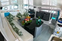 Interior of 2005 Marsaudon Composites T 50 Catamaran with cozy seating and modern decor.
