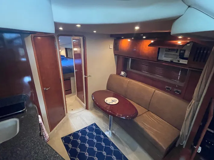 Knot Justified Yacht Photos Pics Interior of 2006 Sea Ray 38 Sundancer yacht with cozy seating and elegant wood finishes.