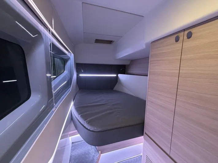  Yacht Photos Pics Interior cabin of 2025 Aquila 42 Coupe yacht with modern design and cozy sleeping area.