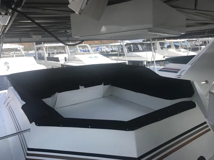  Yacht Photos Pics 2002 Stardust Cruisers Houseboat docked in a marina, featuring a spacious deck area.