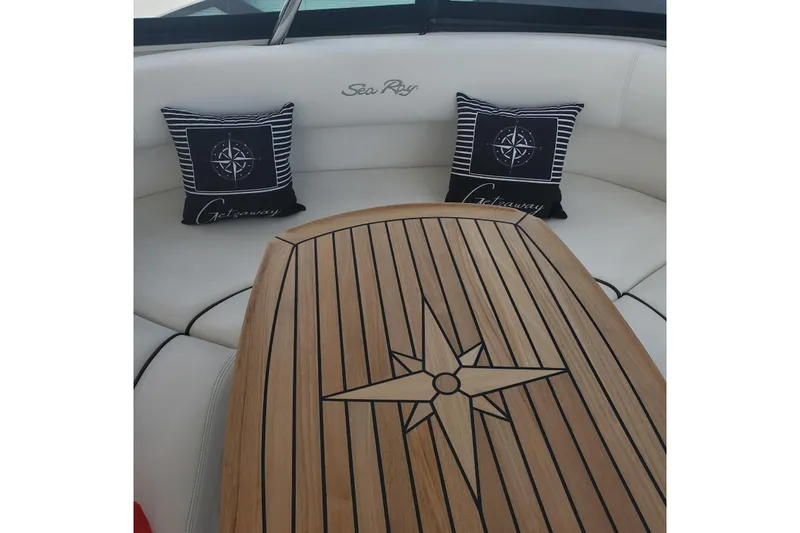  Yacht Photos Pics Luxurious 2007 Sea Ray 580 Sedan Bridge interior with elegant wood table and nautical pillows.