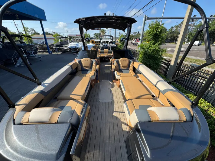  Yacht Photos Pics 2025 Avalon Excalibur 27' boat with luxurious seating and sleek design.